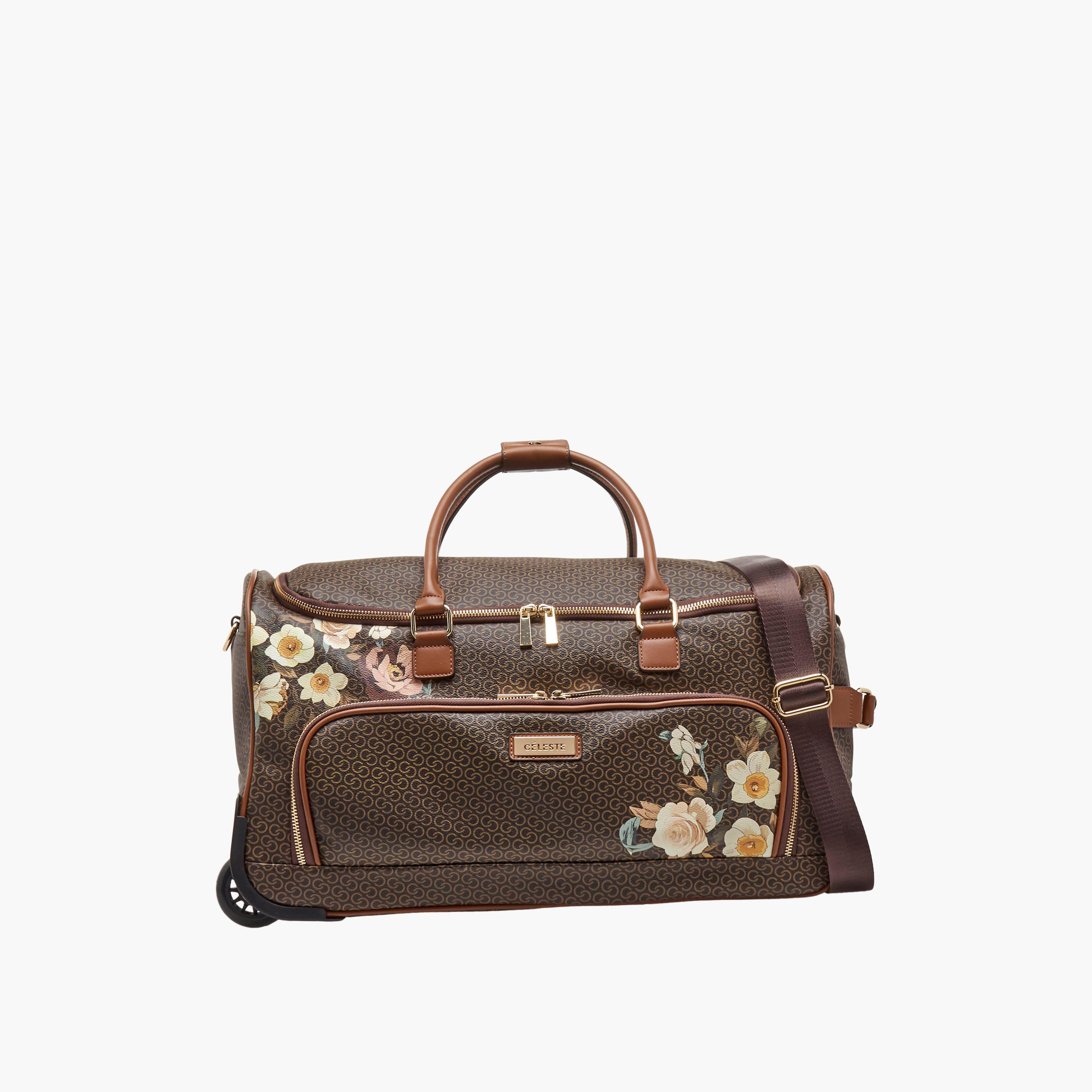 شنطة دافل بطبعات مونوجرام وبمقبض قابل للسحب من سيليست-travel-luggagesandbags-dufflebags-image-1