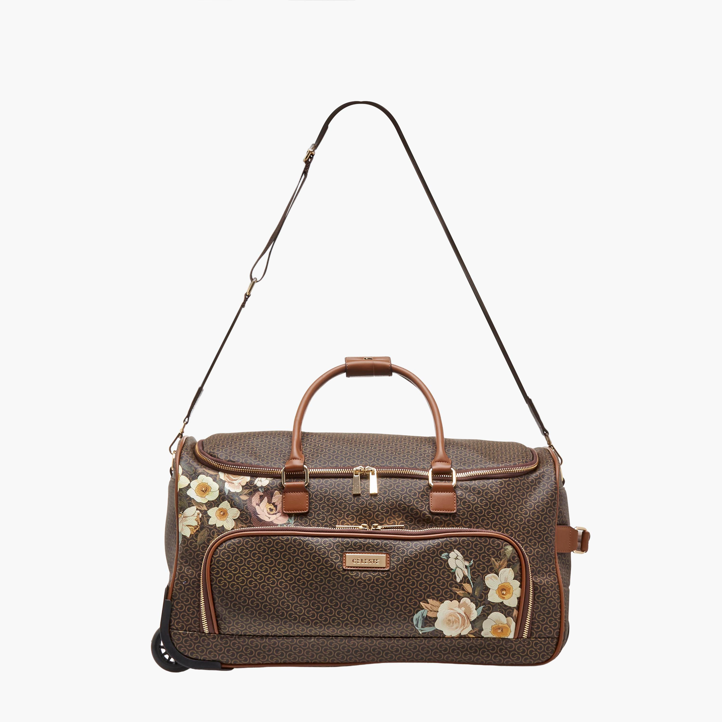 شنطة دافل بطبعات مونوجرام وبمقبض قابل للسحب من سيليست-travel-luggagesandbags-dufflebags-image-3