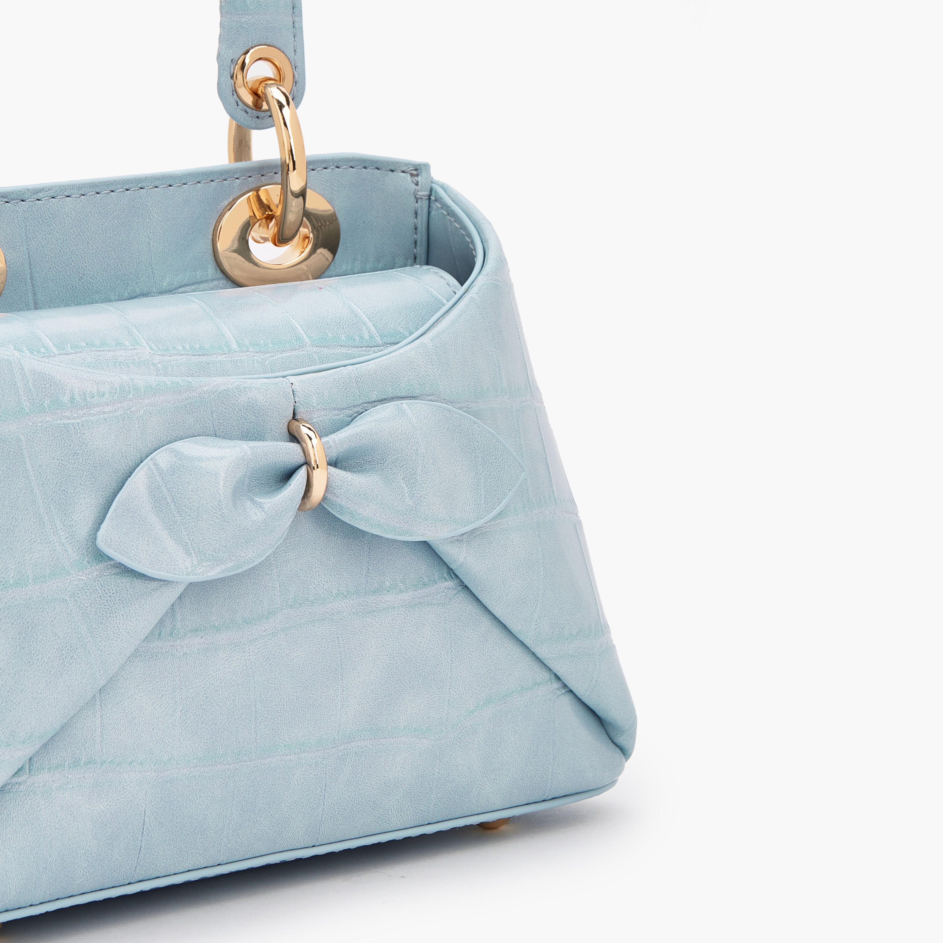 شنطة كروس بودي بزينة فيونكة ومقبض علوي من سيليست-women-bagsandwallets-handbags-image-4